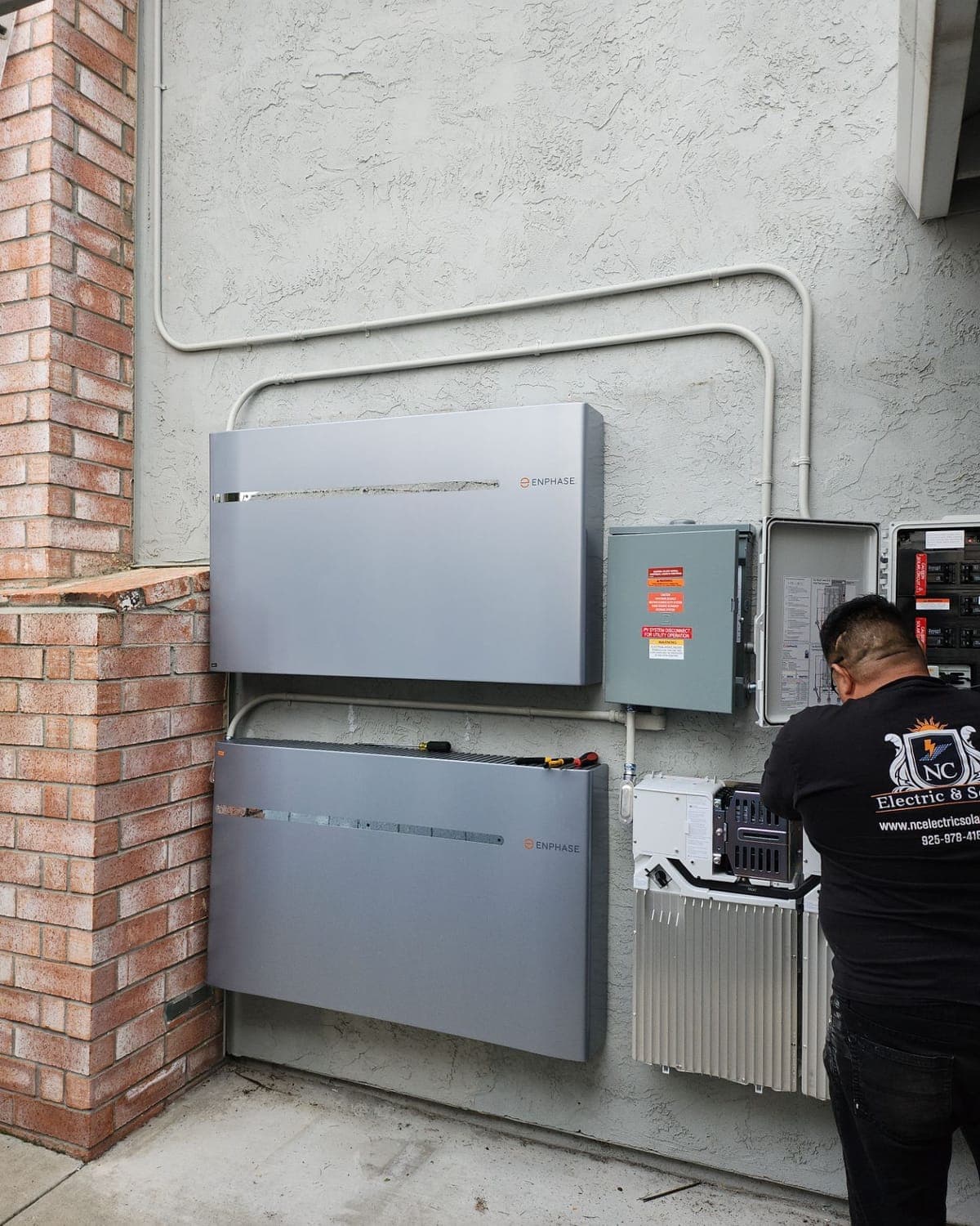 NC Electric & Solar technician commissioning a home battery system
